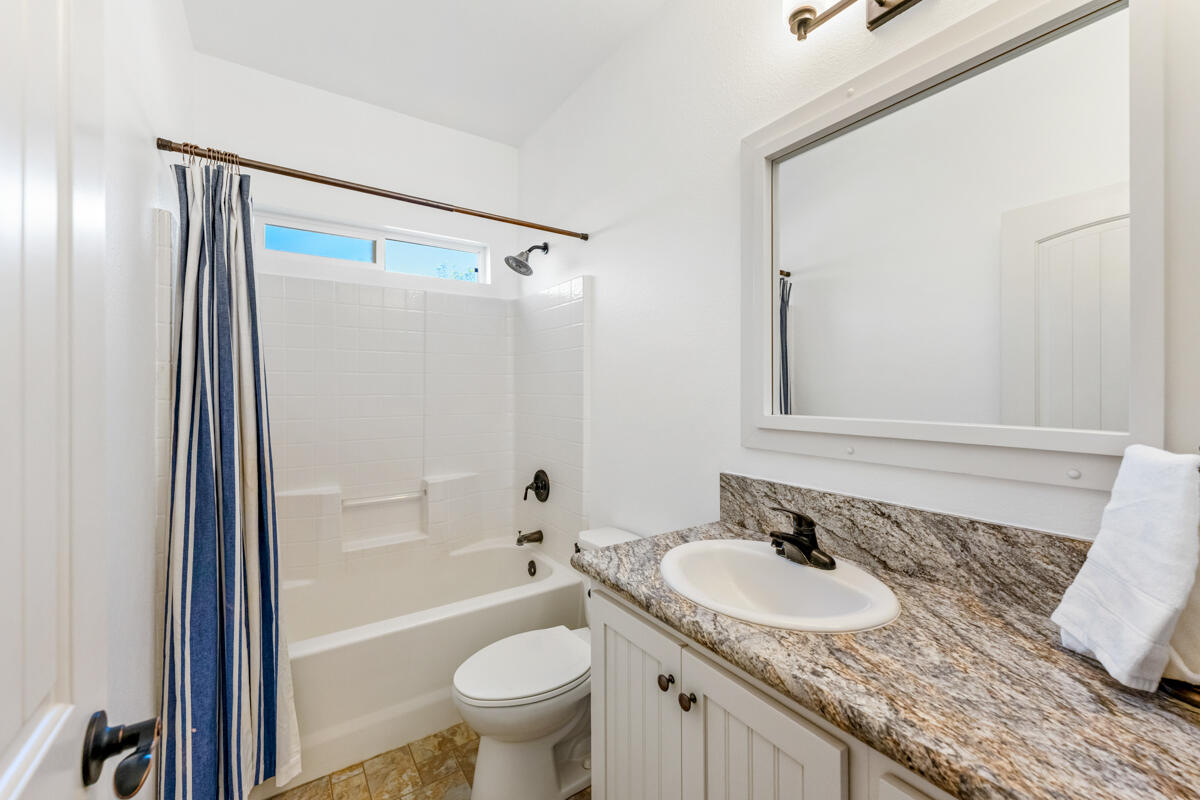 3950 Via Real, Unit 97 Carpinteria, CA 93013 - Photo 26 of 38 a bathroom with a granite countertop sink and a mirror