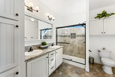 a view of multiple houses with a street