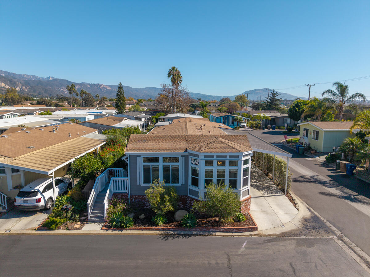 3950 Via Real, Unit 97 Carpinteria, CA 93013 - Photo 3 of 38 a front view of house with yard and green space