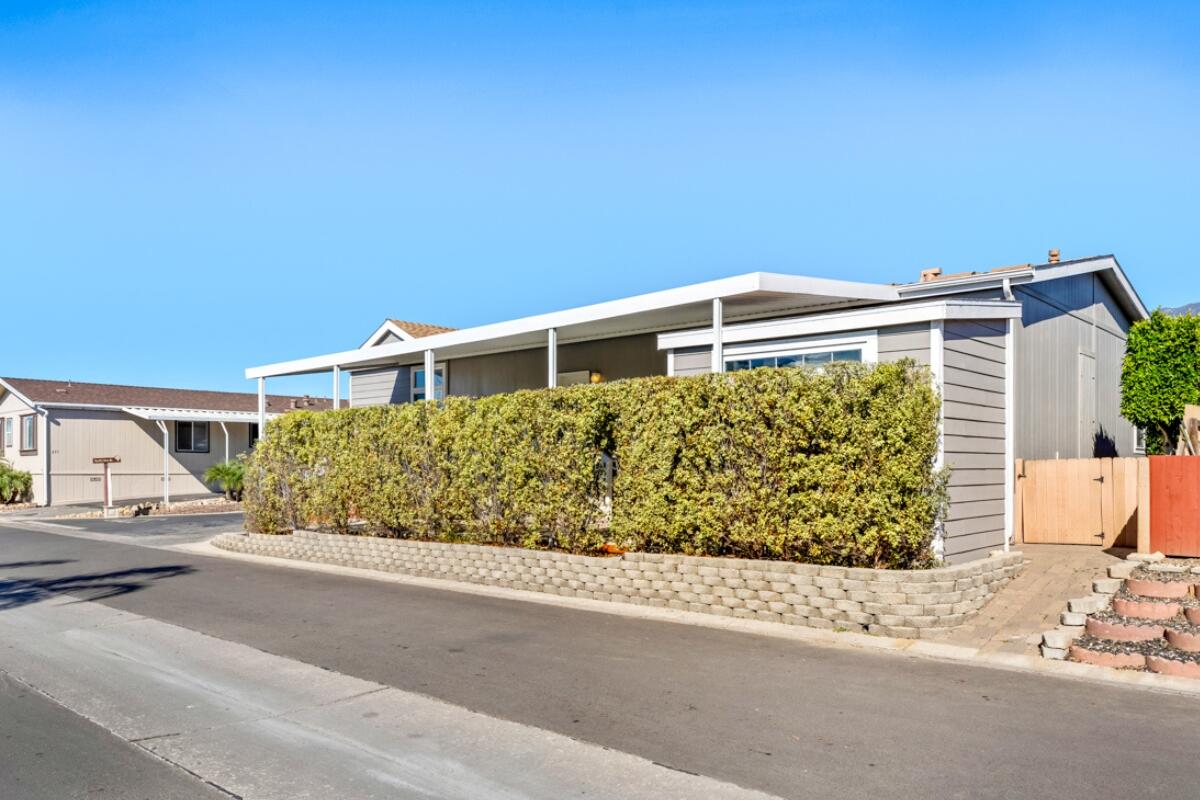 3950 Via Real, Unit 97 Carpinteria, CA 93013 - Photo 31 of 38 a front view of a house with a garden
