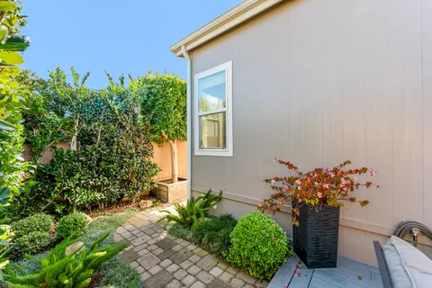 a view of a chairs and table in patio