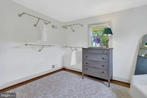 a view of a room with toys and wooden floor