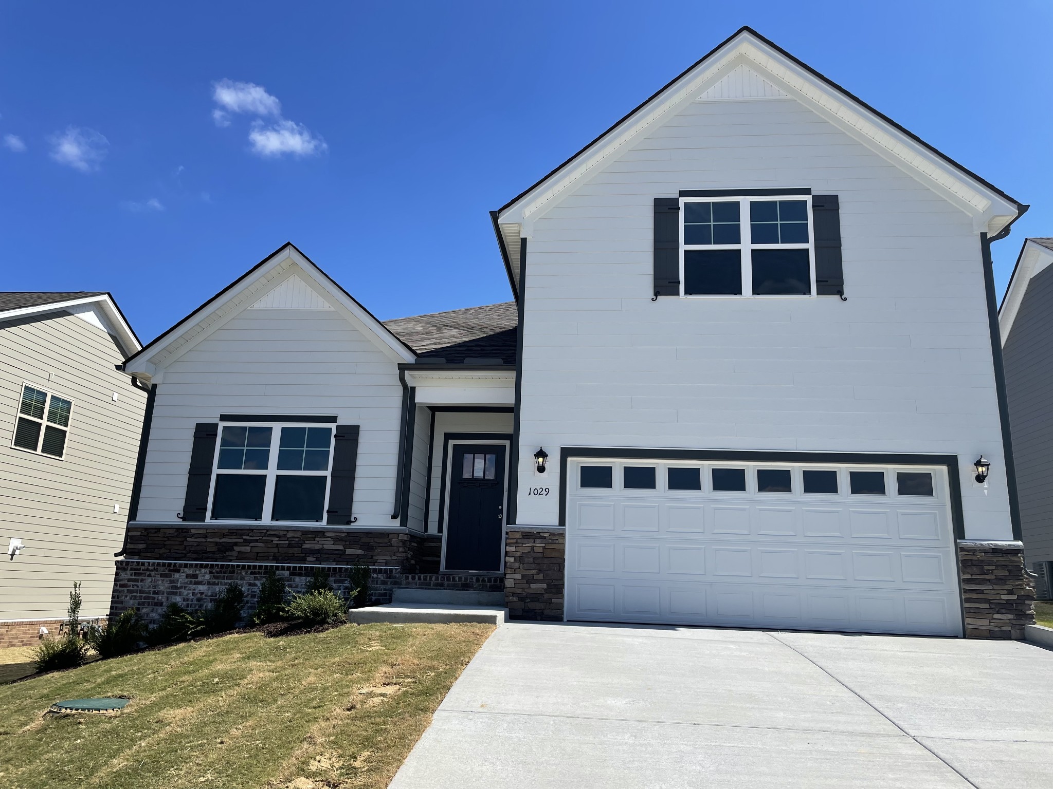 1029 Wiseman Farm Road Fairview, TN 37062 - Photo 1 of 8 a front view of a house with a yard