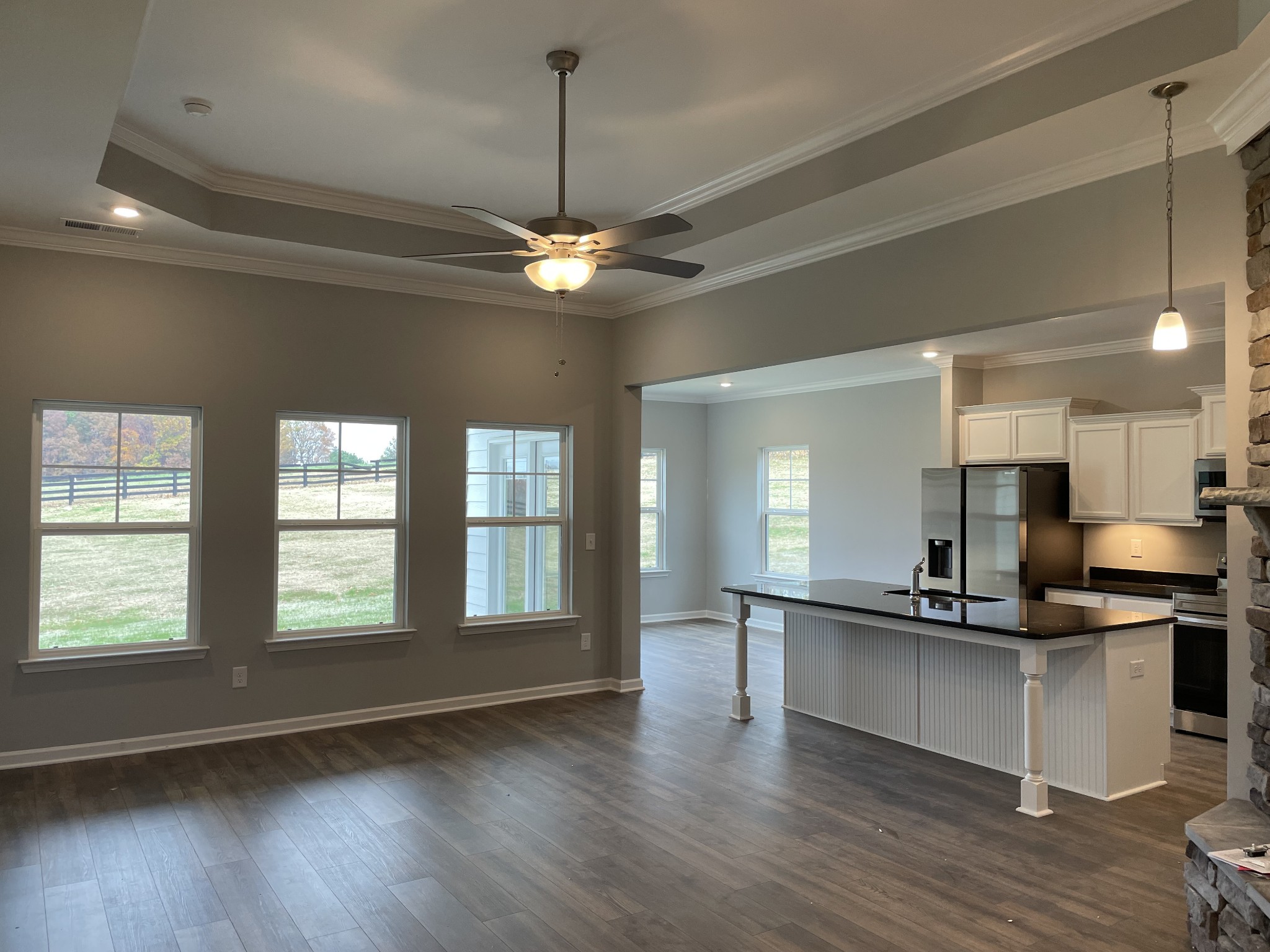 1029 Wiseman Farm Road Fairview, TN 37062 - Photo 2 of 8 a kitchen with stainless steel appliances granite countertop a sink a stove and a wooden floors