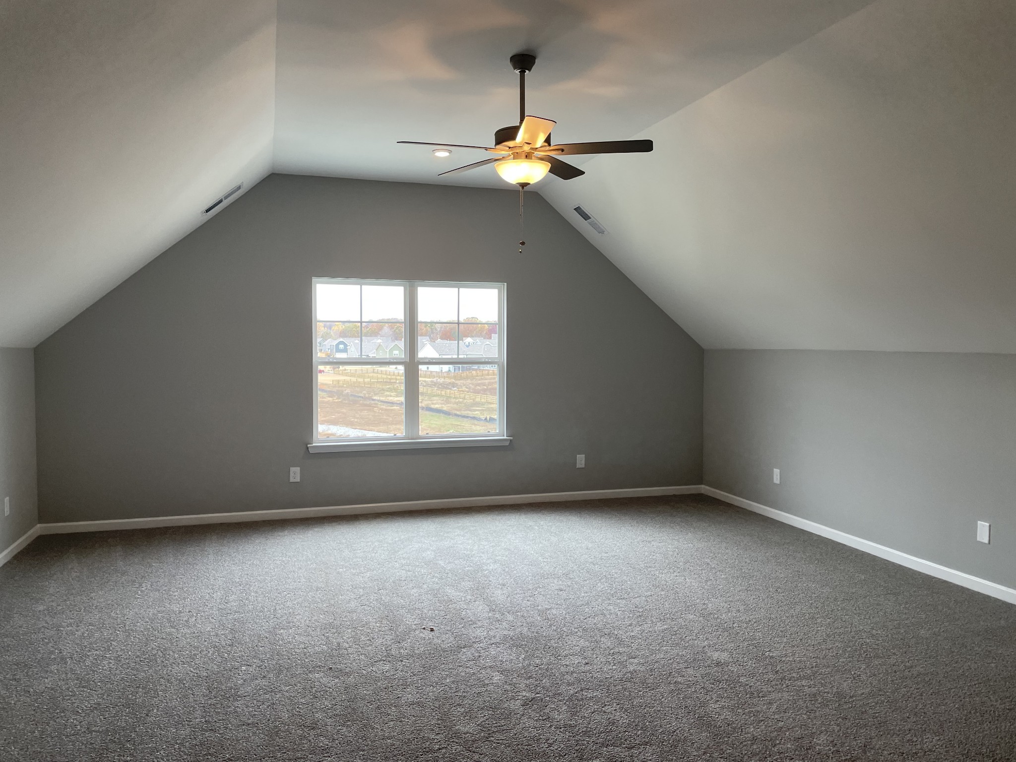 1029 Wiseman Farm Road Fairview, TN 37062 - Photo 7 of 8 a view of a livingroom with a ceiling fan and window