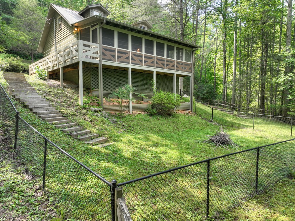 106 Butler Creek Road Cherry Log, GA 30522 - Photo 50 of 58 a view of a house with backyard and sitting area