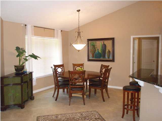 2445 Crescent Road Navarre, FL 32566 - Photo 6 of 25 a view of a dining room with furniture
