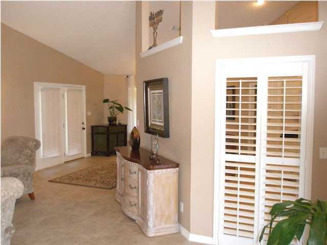 2445 Crescent Road Navarre, FL 32566 - Photo 9 of 25 a view of hallway with living room and furniture