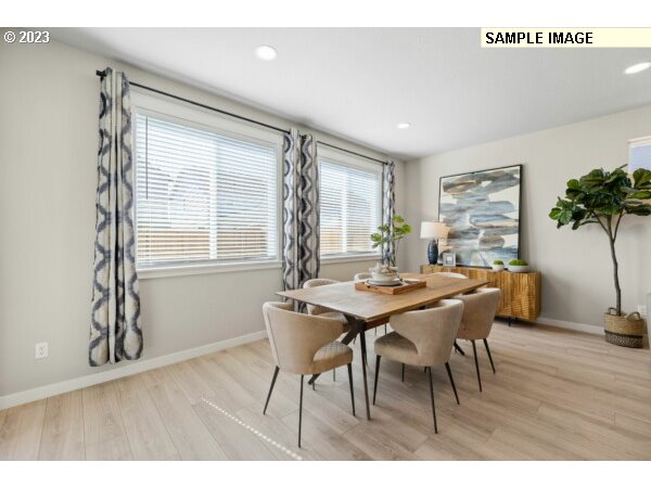 208 South 87th Avenue, Unit 60 Ridgefield, WA 98642 - Photo 19 of 32 a view of a dining room with furniture window and wooden floor