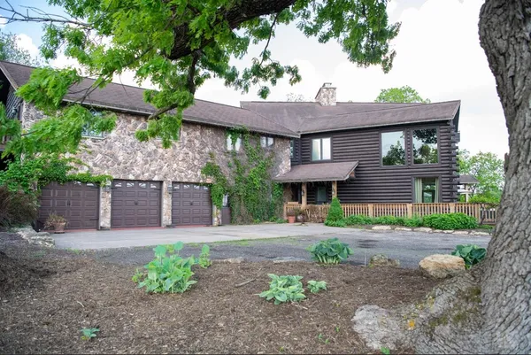 a view of an entryway with wooden floor and windows