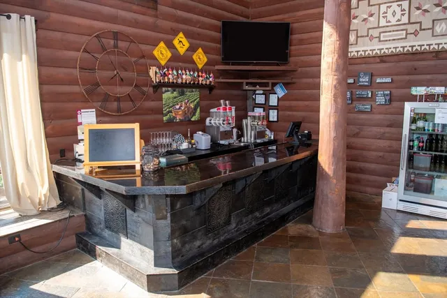 a room with lots of tables and large windows