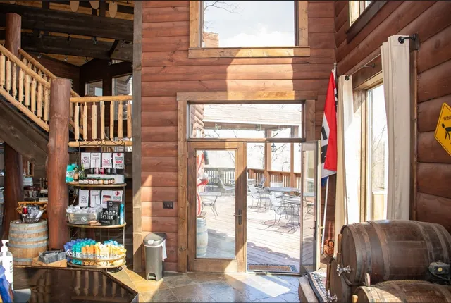 a dining room with a table and chairs