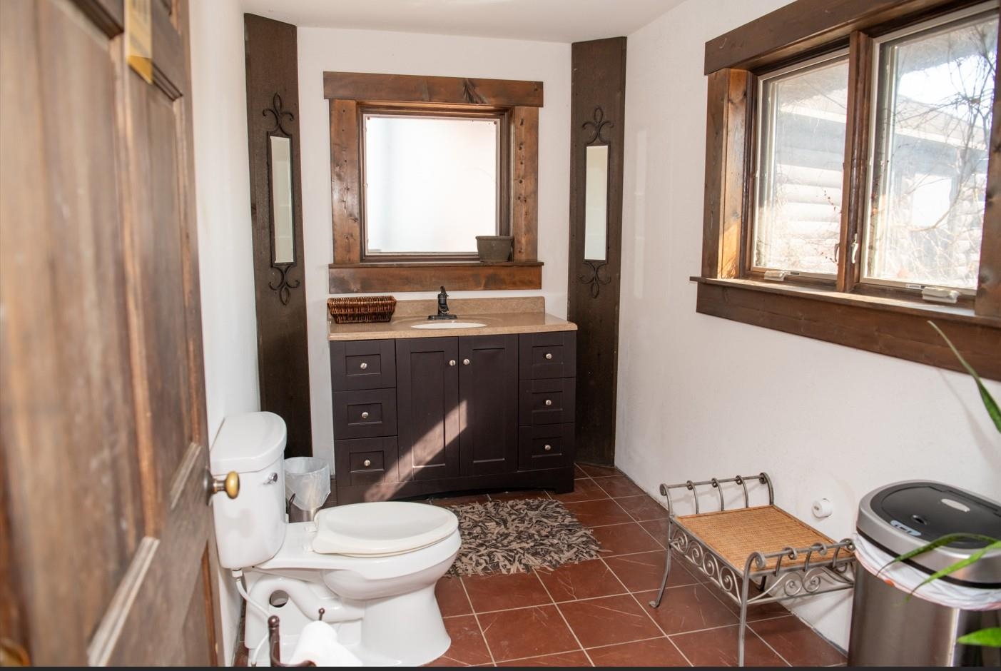 2003 West Hanover Road Hanover, IL 61041 - Photo 35 of 61 a bathroom with a toilet a sink and a window