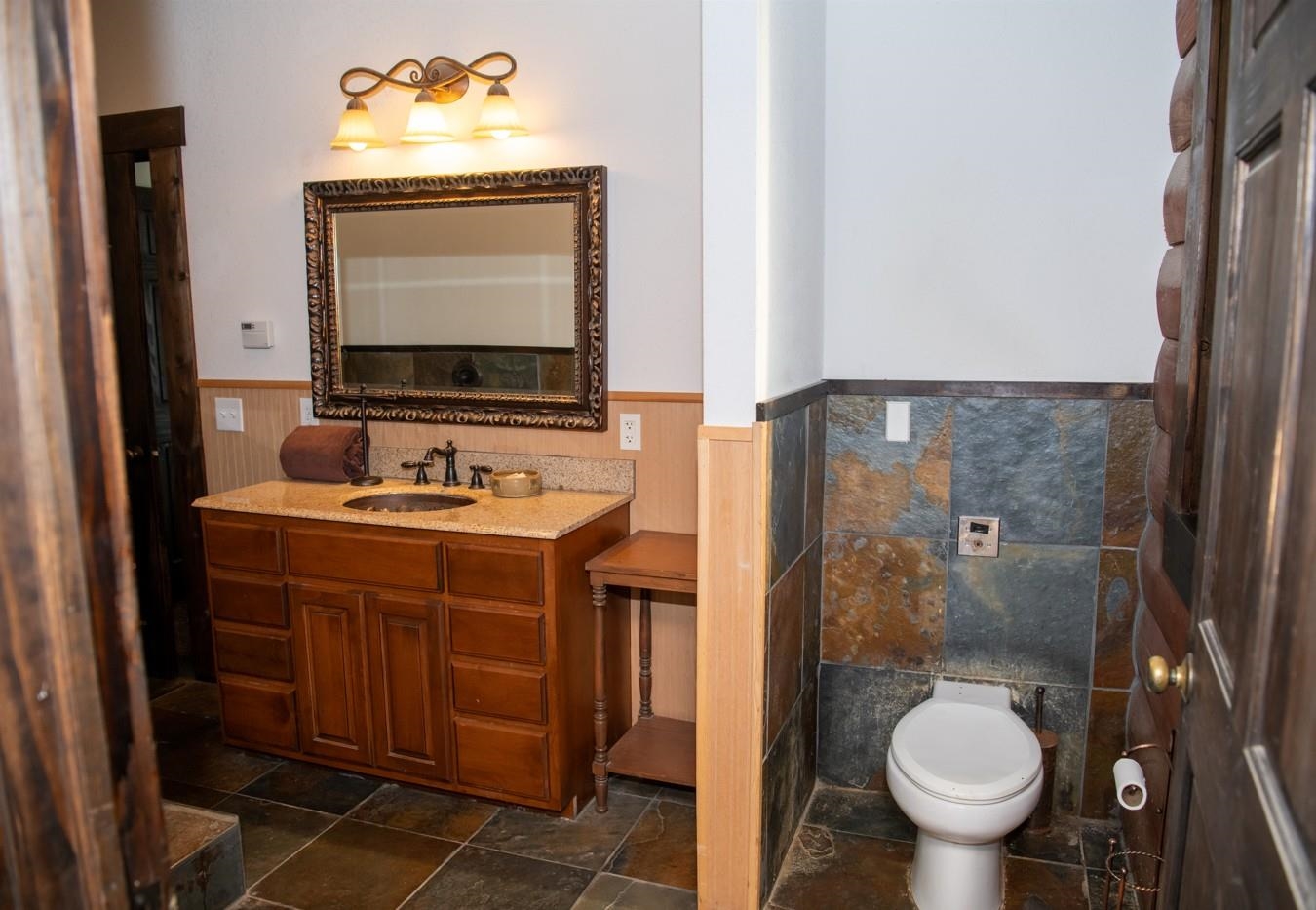 2003 West Hanover Road Hanover, IL 61041 - Photo 38 of 61 a bathroom with a toilet sink and mirror