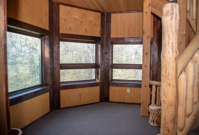 an aerial view of a house with outdoor space