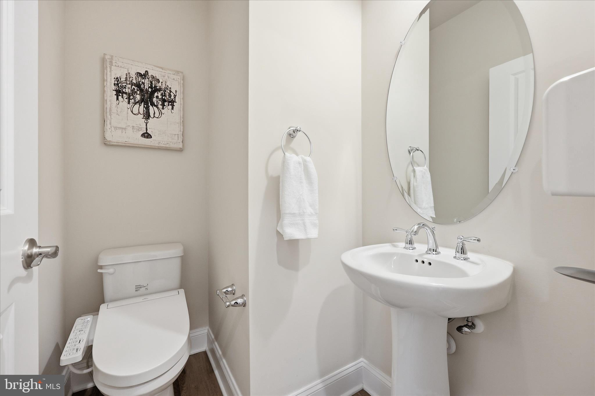 1090 Holden Road Frederick, MD 21701 - Photo 14 of 60 a bathroom with a toilet sink and mirror