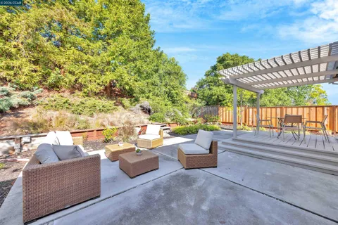 a outdoor living space with furniture and city view