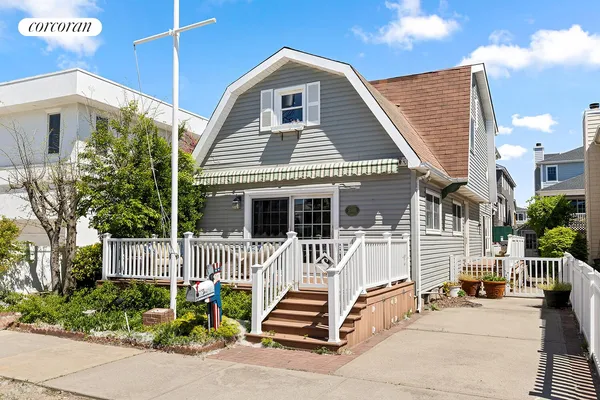 a front view of a house with a porch