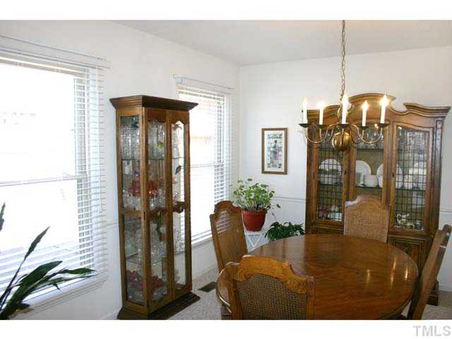 5026 Raintree Road Durham, NC 27712 - Photo 3 of 12 Dining Room has chair rail and plenty of wall space for furniture. It is conveniently located adjacent to the ktichen. Dining Room