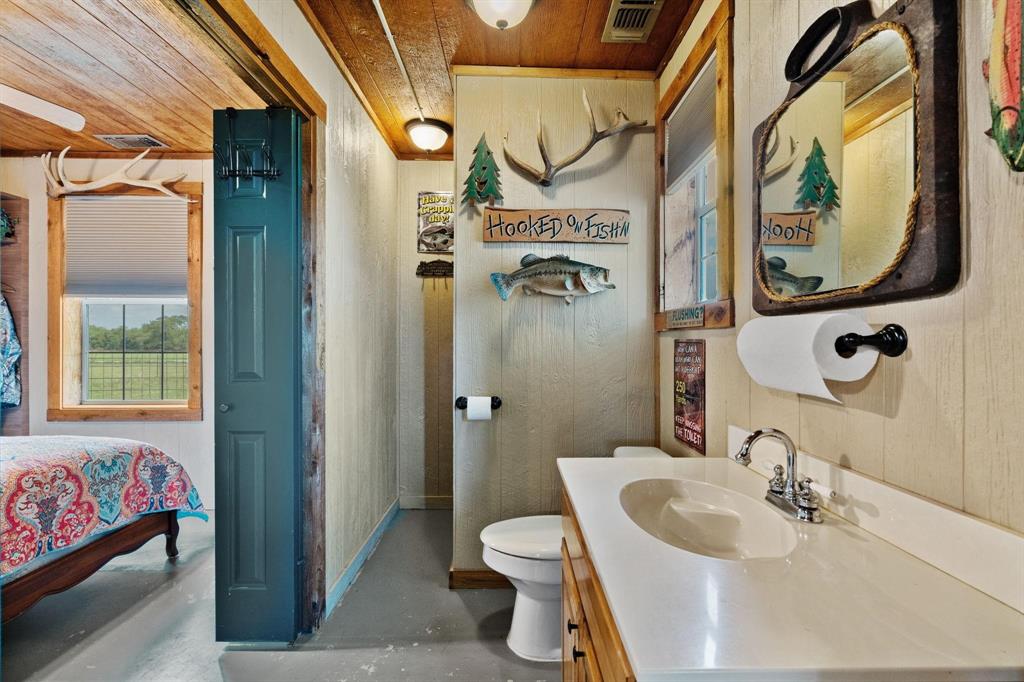 2931 Wall Street Road Howe, TX 75459 - Photo 16 of 38 a bathroom with a sink and a mirror