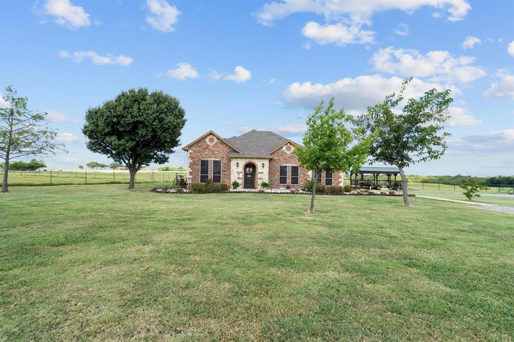 2931 Wall Street Road Howe, TX 75459 - Photo 2 of 38 a view of house with garden space and trees