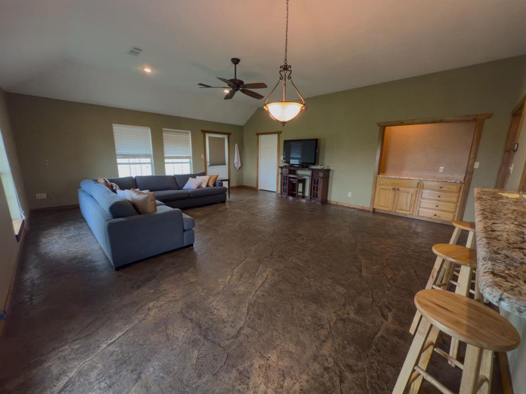 2931 Wall Street Road Howe, TX 75459 - Photo 22 of 38 a living room with furniture and a flat screen tv