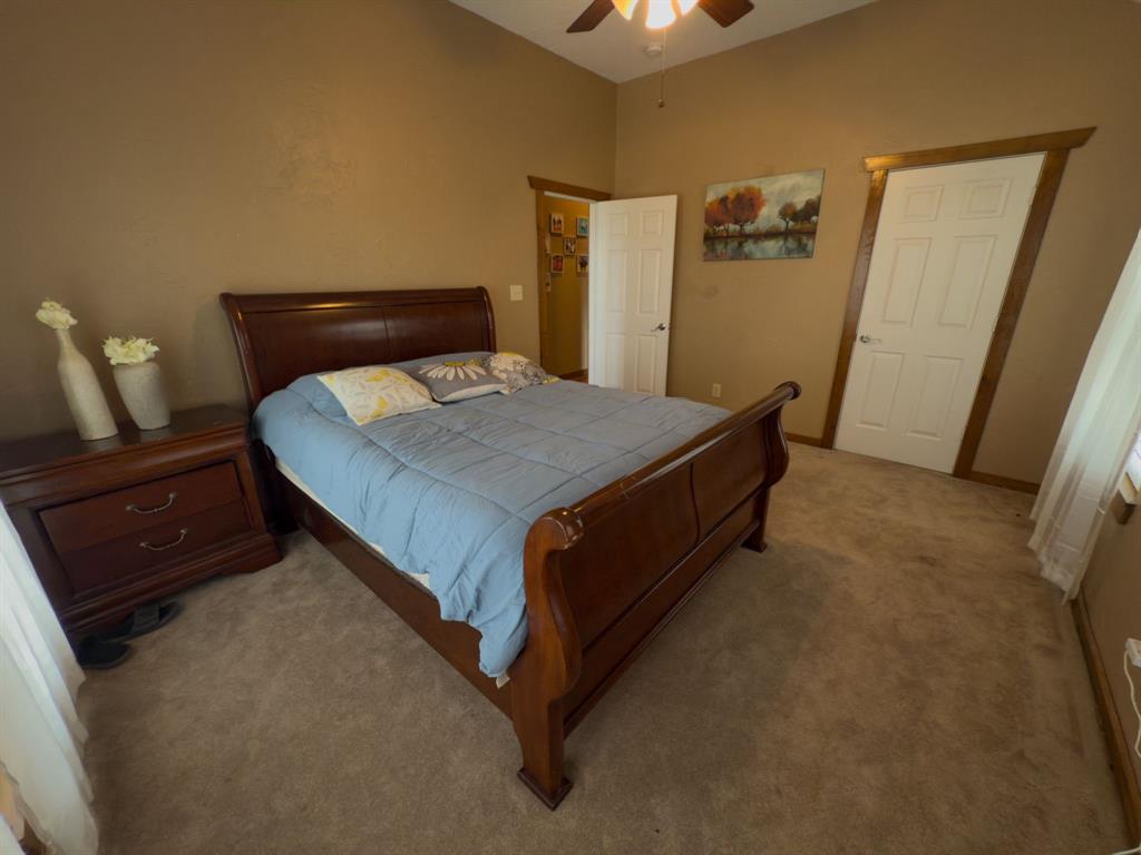 2931 Wall Street Road Howe, TX 75459 - Photo 29 of 38 a bedroom with a bed and wooden floor