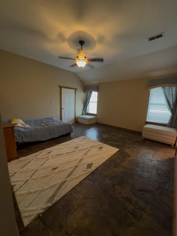 2931 Wall Street Road Howe, TX 75459 - Photo 36 of 38 a bedroom with a bed and a chandelier