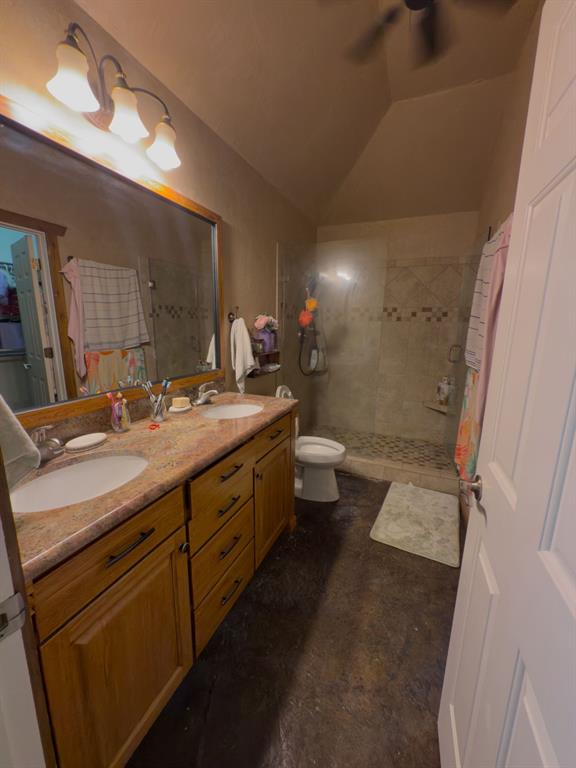 2931 Wall Street Road Howe, TX 75459 - Photo 38 of 38 a bathroom with a double vanity sink toilet and shower