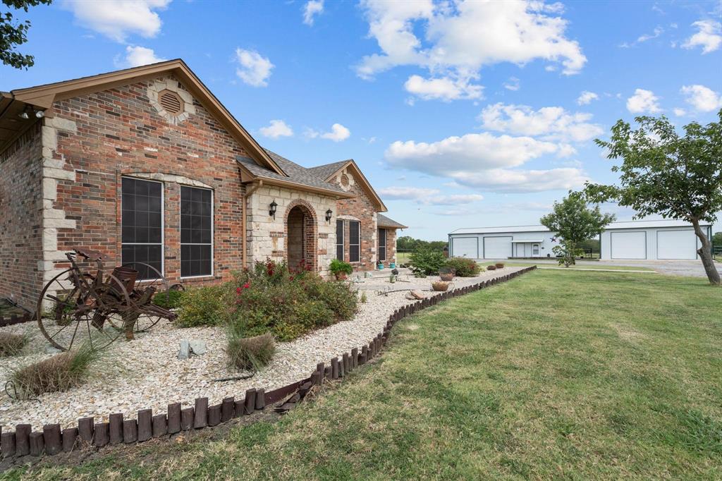 2931 Wall Street Road Howe, TX 75459 - Photo 4 of 38 a front view of a house with garden