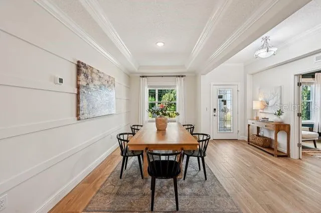 a view of a dining room with furniture and wooden floor