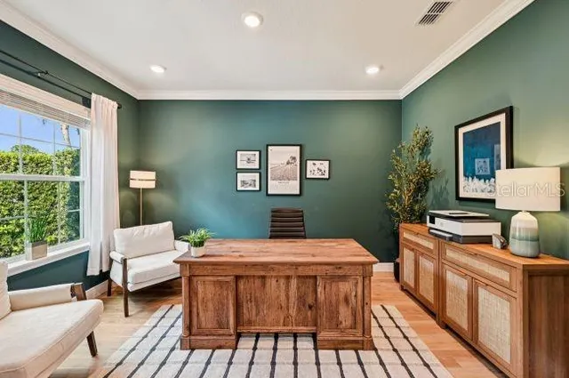 a room with furniture pool table and window