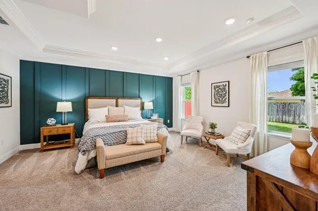 a bedroom with furniture and a potted plant