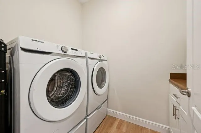 a utility room with dryer and washer