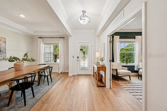 a view of a livingroom with furniture window and wooden floor