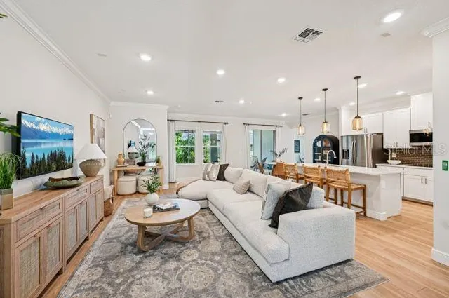 a living room with fireplace furniture and a flat screen tv