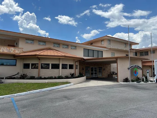 a view of a swimming pool and an outdoor seating