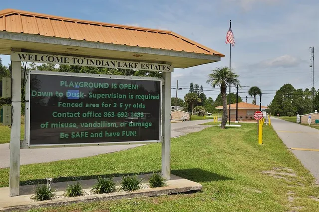 an aerial view of a house with outdoor space patio and lake view
