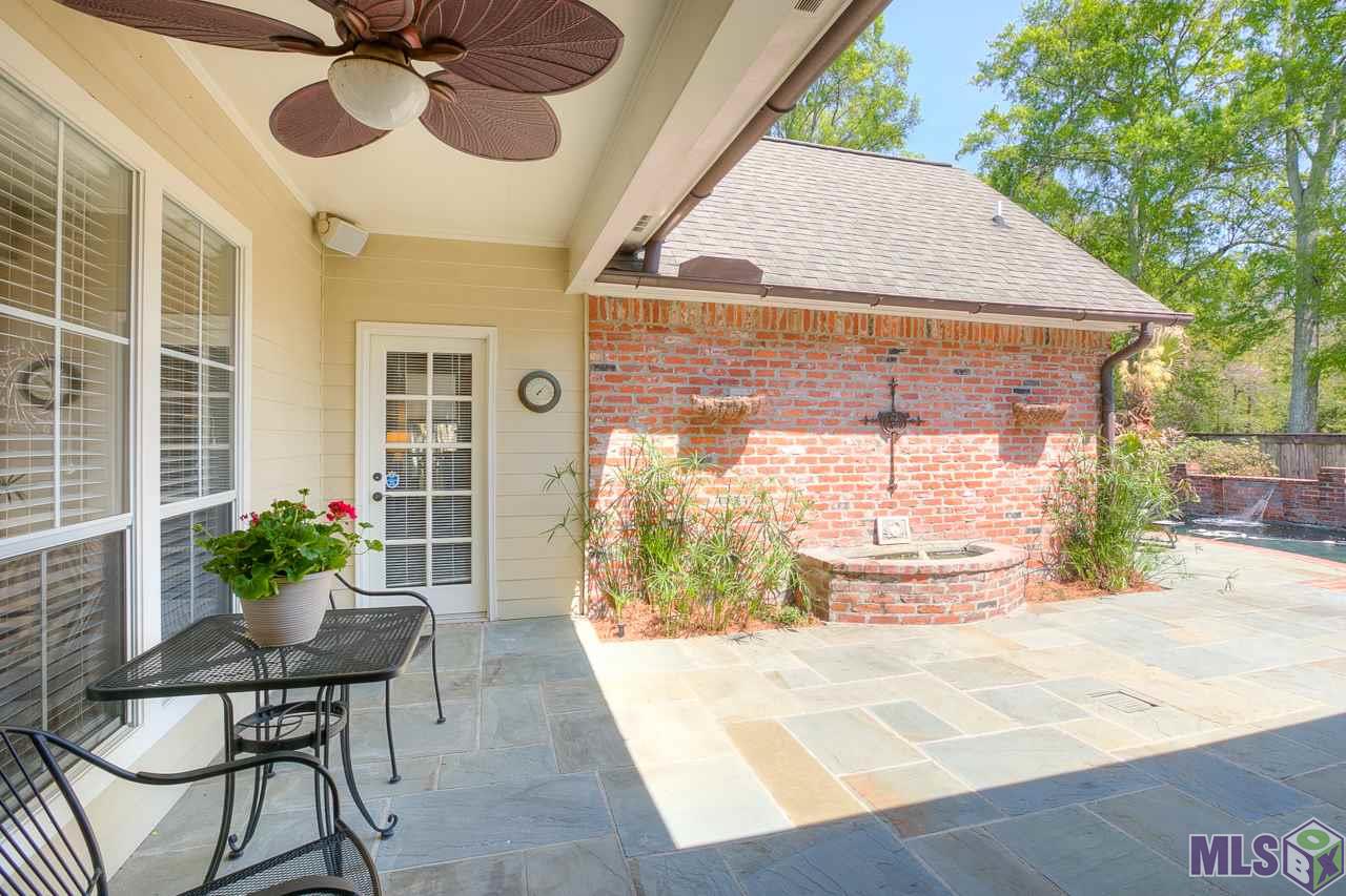 418 Plantation Ridge Drive Baton Rouge, LA 70810 - Photo 24 of 32 COVERED PATIO LOOKING TOWARD FOUNTAIN