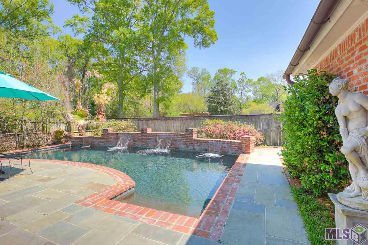 418 Plantation Ridge Drive Baton Rouge, LA 70810 - Photo 29 of 32 GARDEN STATUE NEAR THE POOL DOES NOT STAY