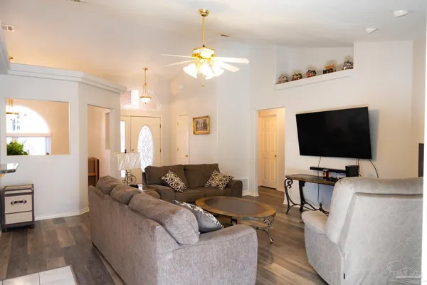 a living room with furniture and a flat screen tv