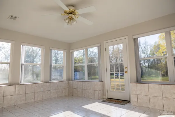 a view of empty room with windows
