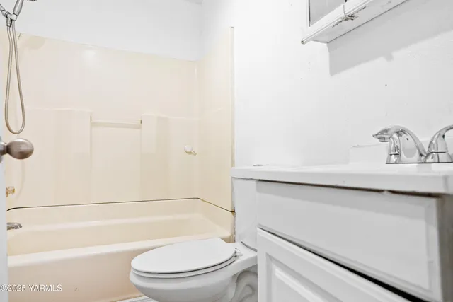 a bathroom with a toilet a sink and bathtub