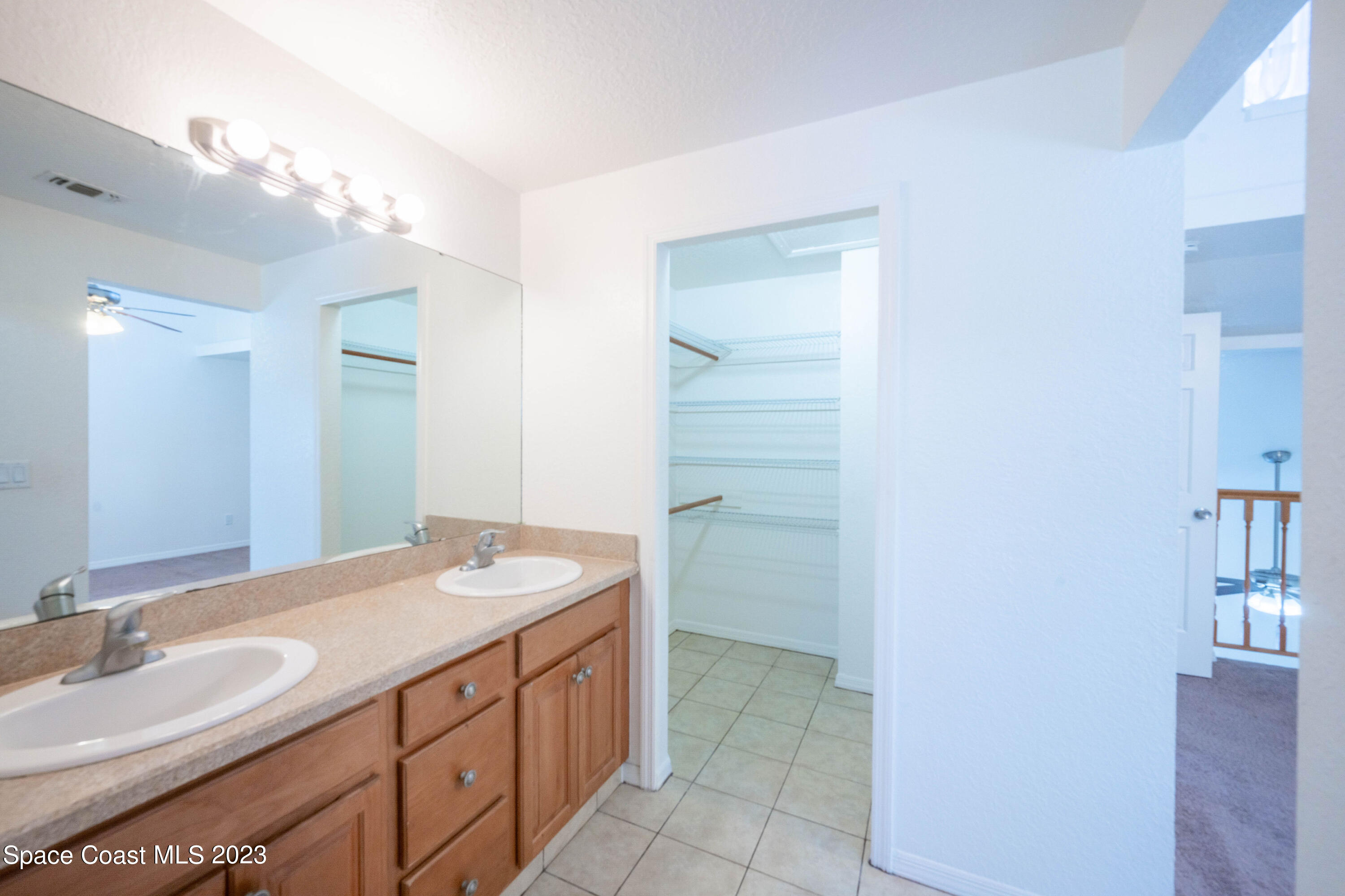 1130 Gary Hunt Road, Unit B Cocoa, FL 32926 - Photo 23 of 33 a bathroom with a sink a vanity and a mirror