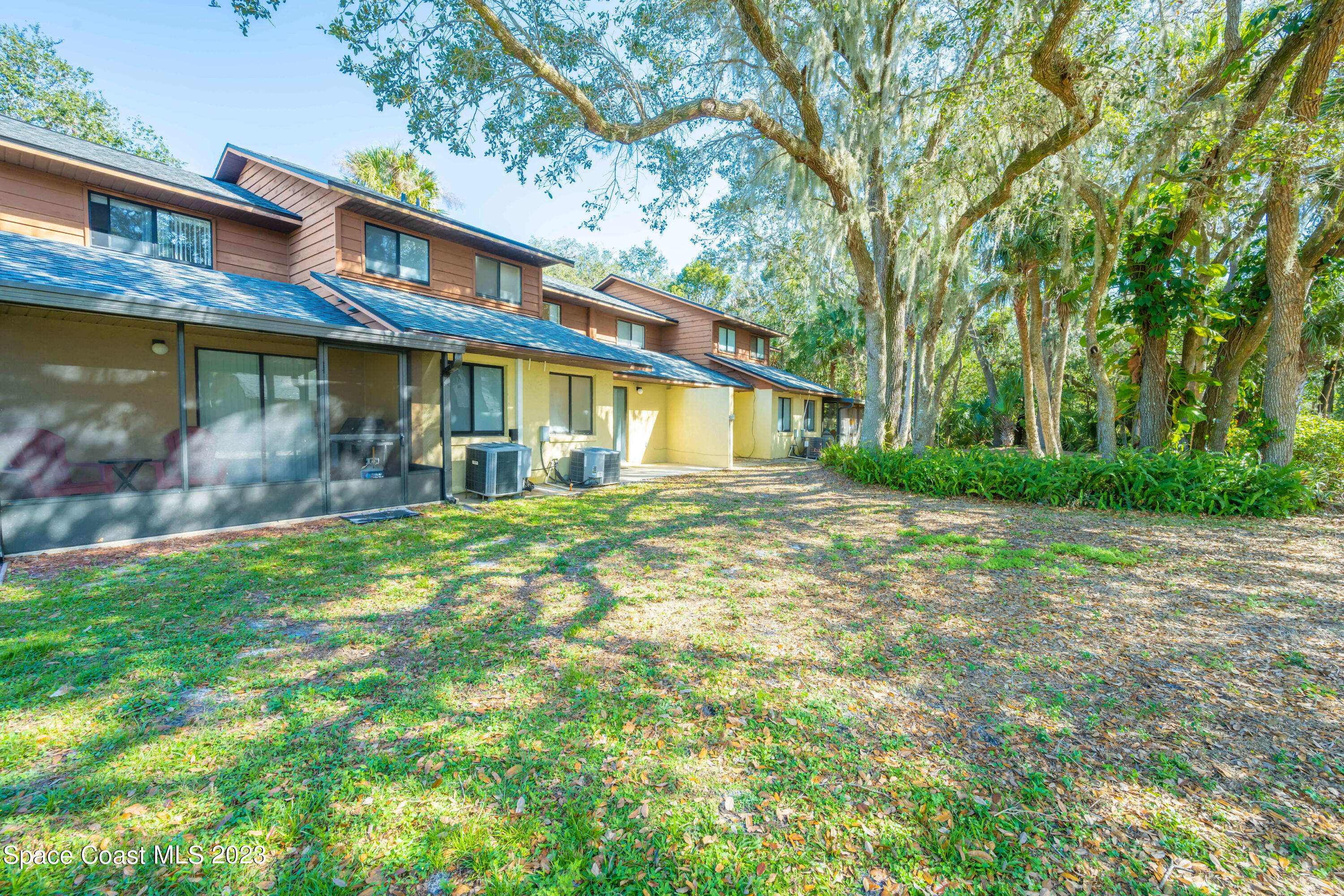 1130 Gary Hunt Road, Unit B Cocoa, FL 32926 - Photo 27 of 33 a front view of house with yard and green space