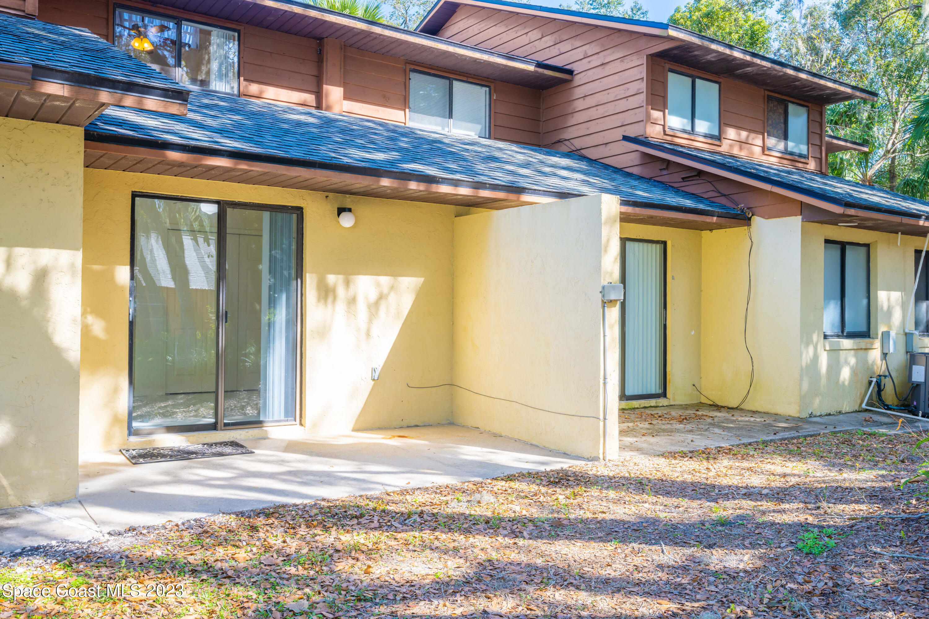 1130 Gary Hunt Road, Unit B Cocoa, FL 32926 - Photo 28 of 33 a view of a brick house with a large windows
