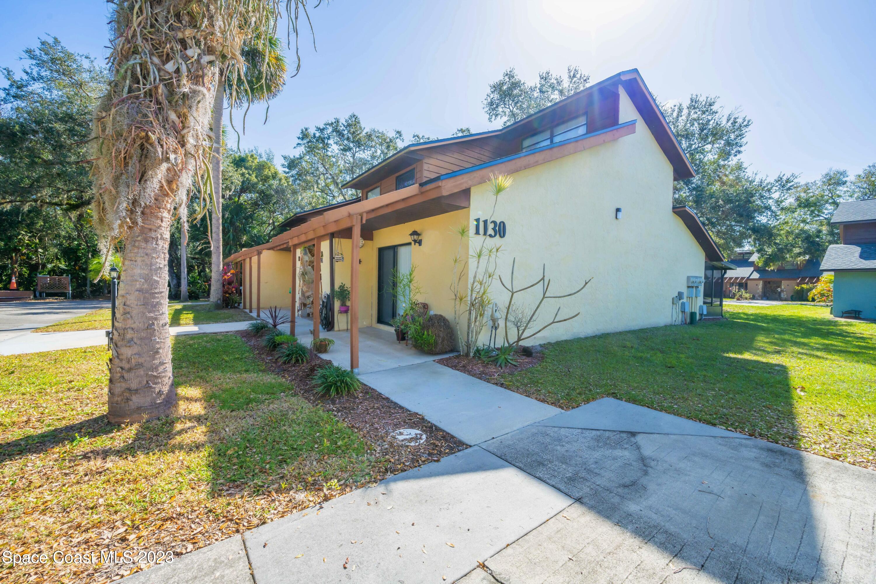 1130 Gary Hunt Road, Unit B Cocoa, FL 32926 - Photo 29 of 33 a view of a house with backyard and sitting area
