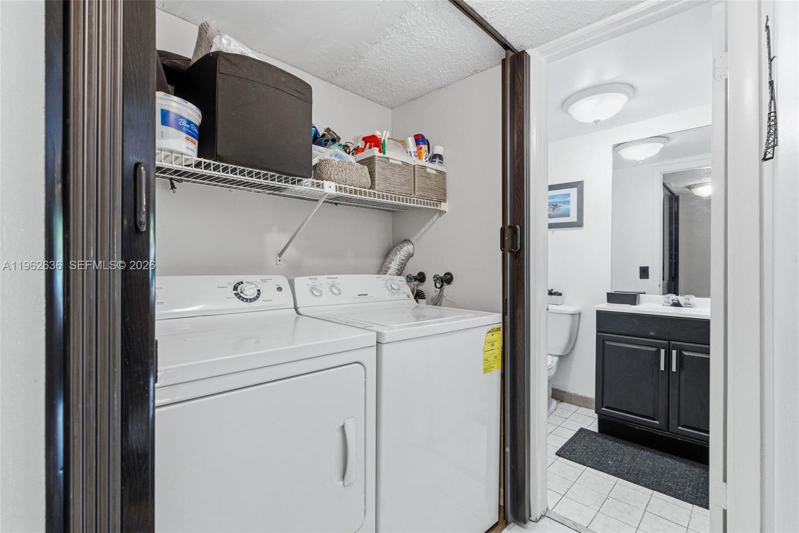 4726 Southwest 67th Avenue, Unit F6 Miami, FL 33155 - Photo 18 of 37 a utility room with dryer and washer