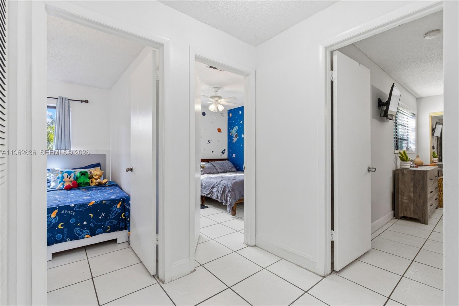 4726 Southwest 67th Avenue, Unit F6 Miami, FL 33155 - Photo 21 of 37 a bedroom with a bed and a cabinets