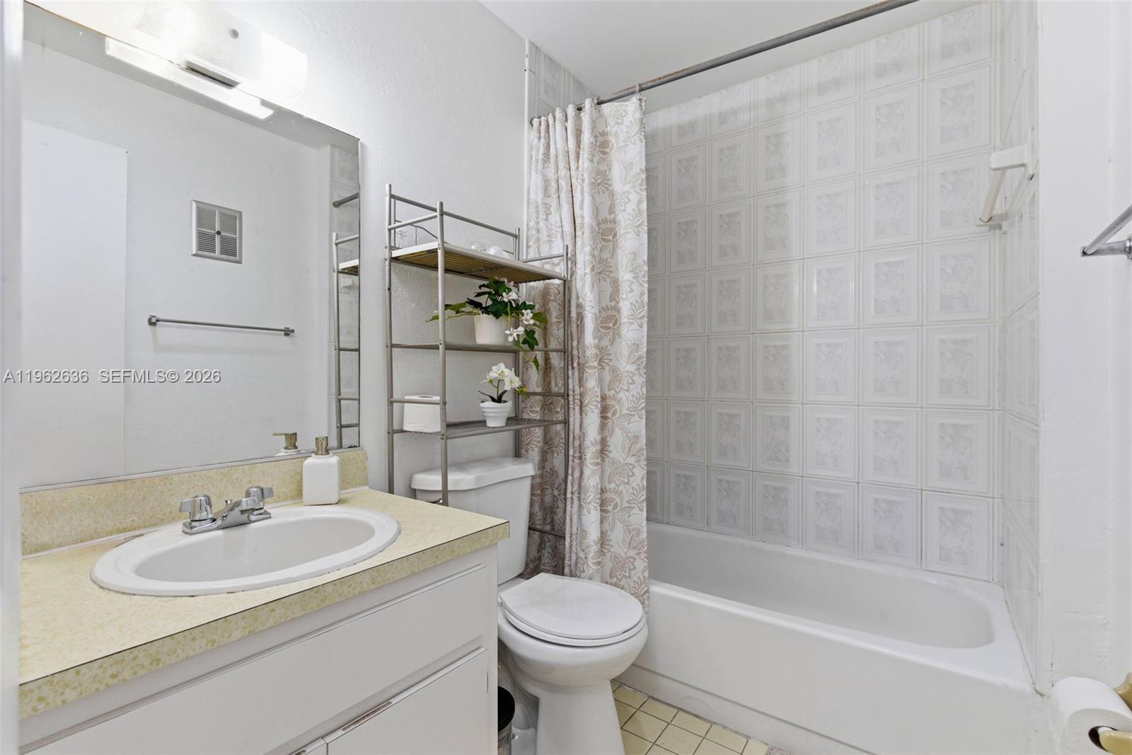 4726 Southwest 67th Avenue, Unit F6 Miami, FL 33155 - Photo 24 of 37 a bathroom with a sink toilet and shower